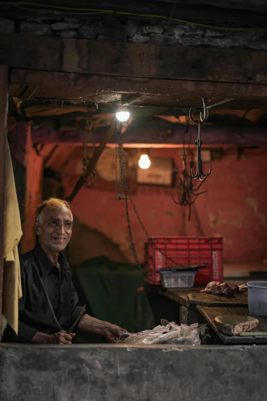 a man standing next to food in a warehouse