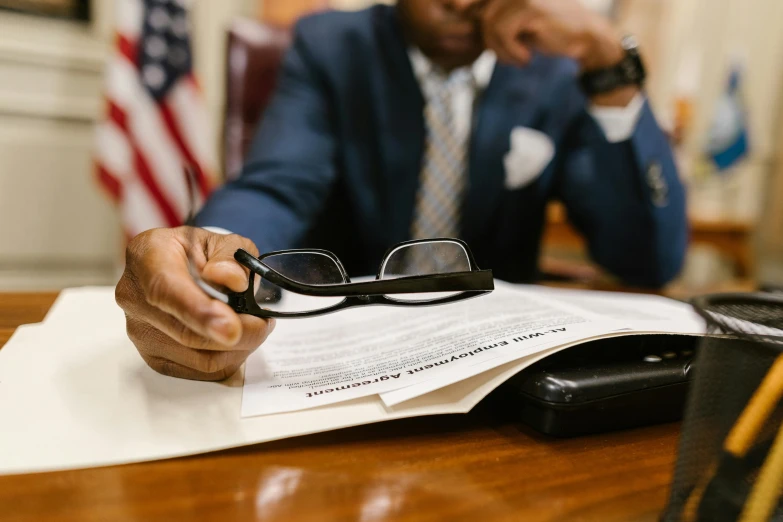 a man sitting in front of a piece of paper