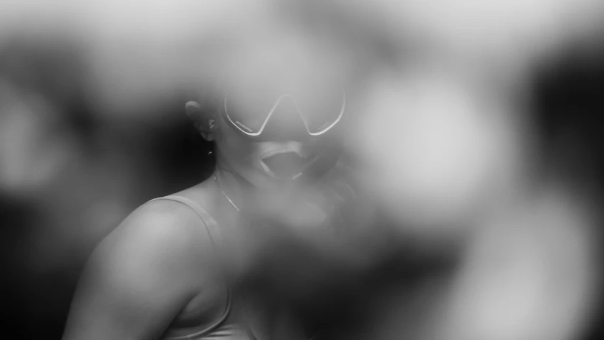 a black and white image of a woman with a blindfold