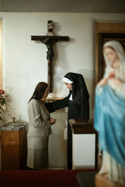 two young women dressed in black dressed in white