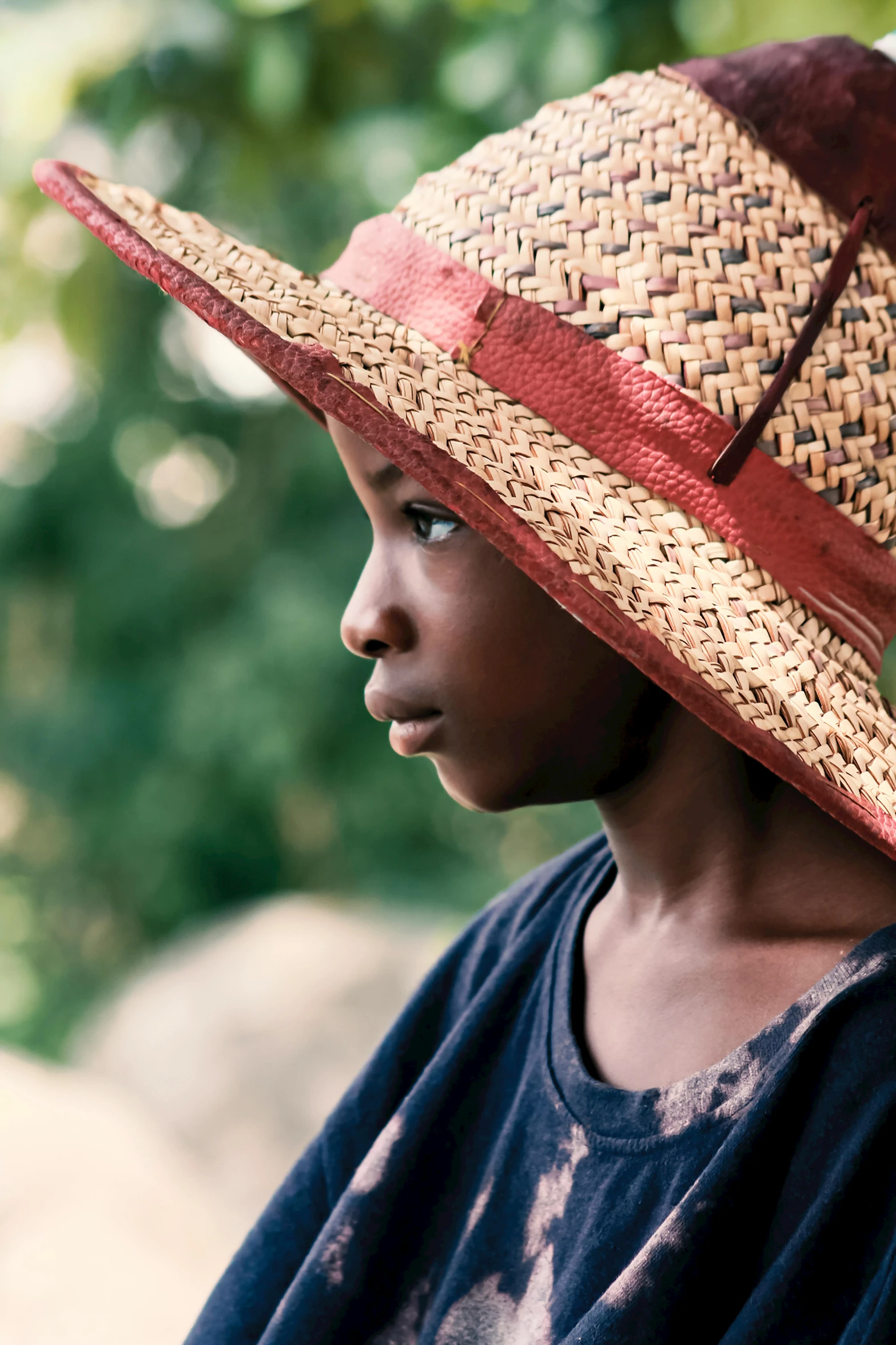 the young person wearing the hat is looking away