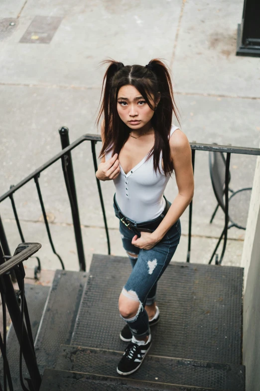 a young woman posing on a stair way