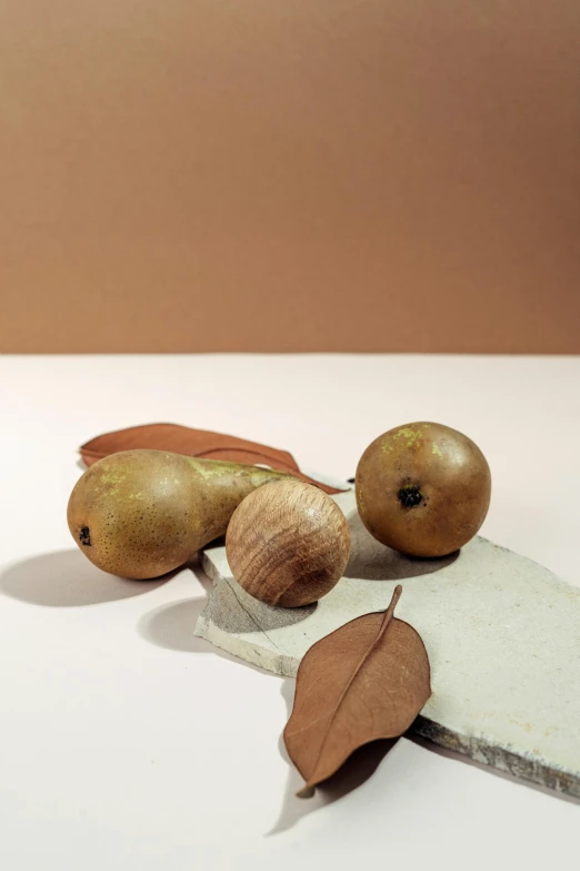 a close up of a knife with some fruits on it