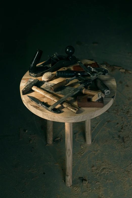 the tools are piled up and sitting on the table