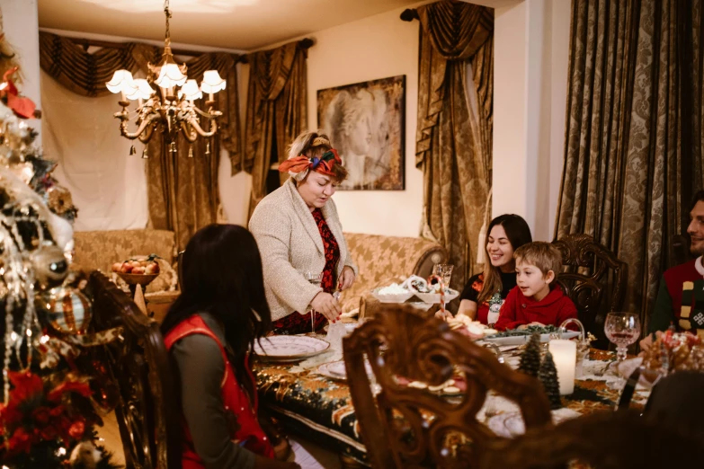 a woman is cooking with her family in a living room