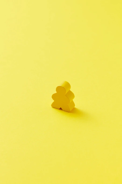 a yellow object that looks like an elephant head