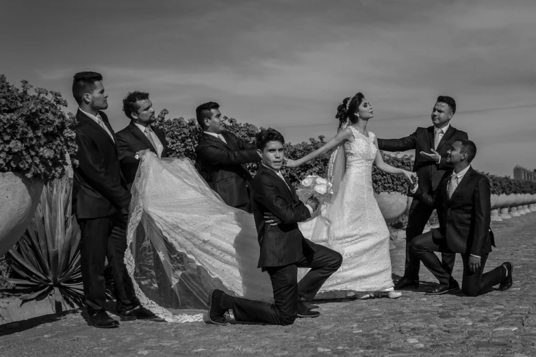 a couple having their pictures taken on their wedding day