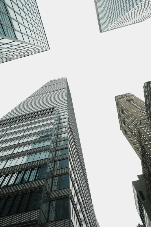 a group of tall buildings with windows on the bottom