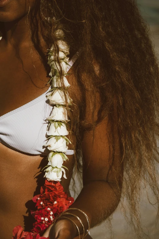 a close up s of a woman wearing a flower garland