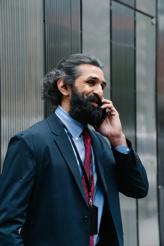 a man in a suit is on the phone