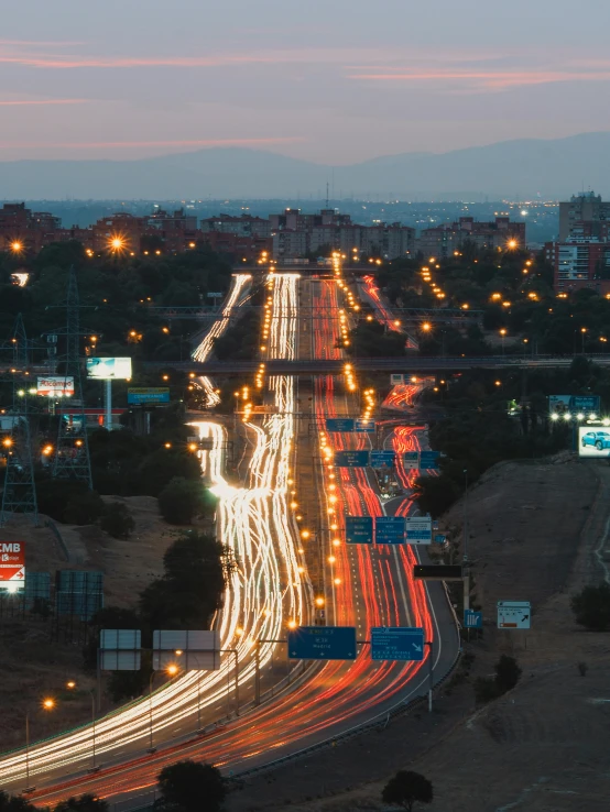 a freeway with busy lights that are all along each side