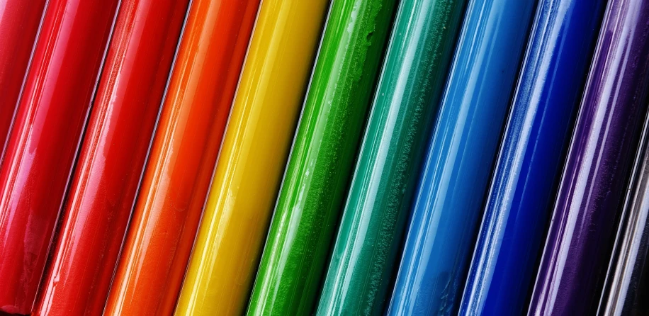 a bunch of different color tubes are in a row
