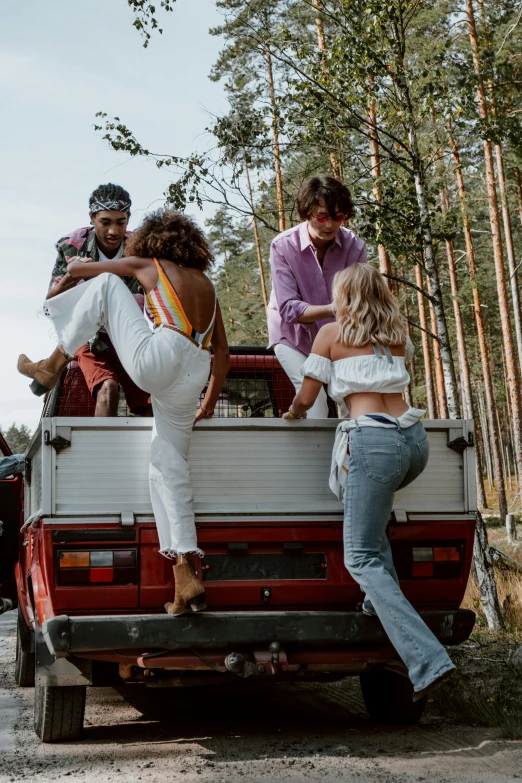 some people in the back of a van on a road