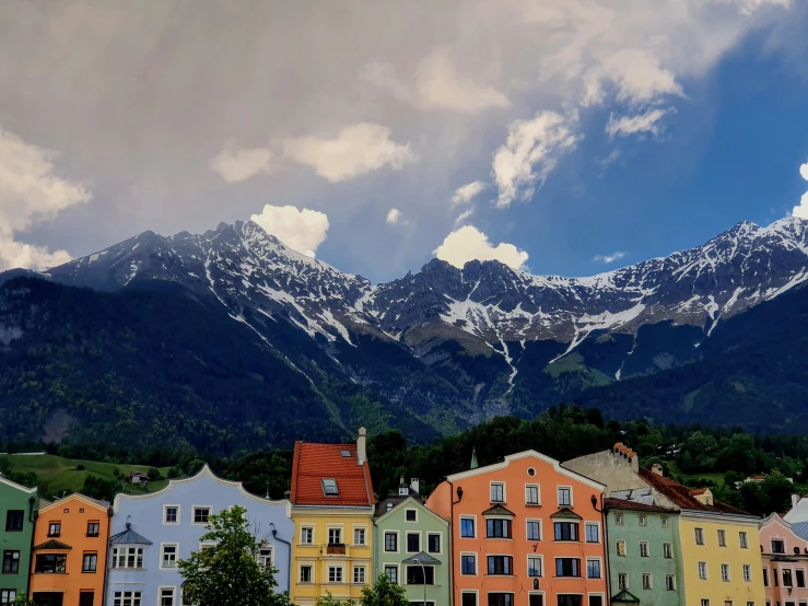 the view of colorful buildings and the mountain tops