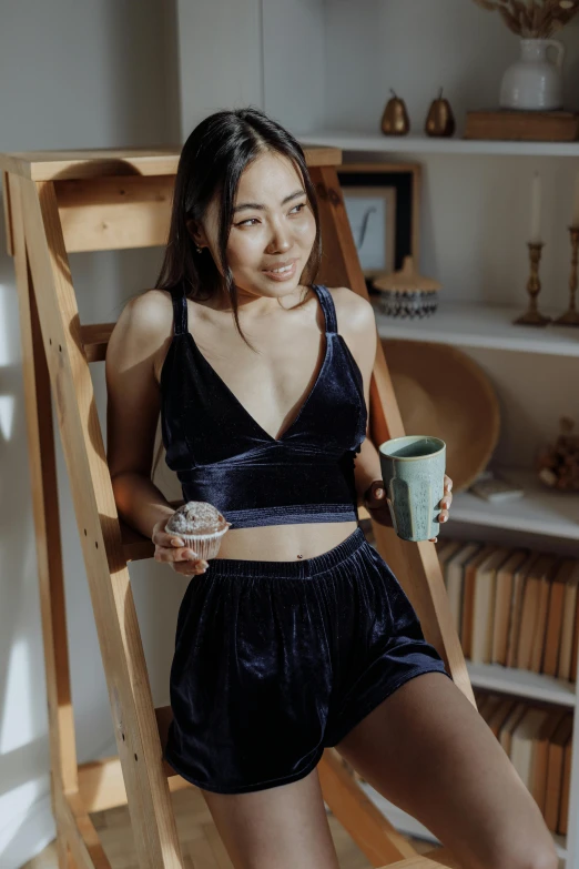 a women who is holding a coffee cup