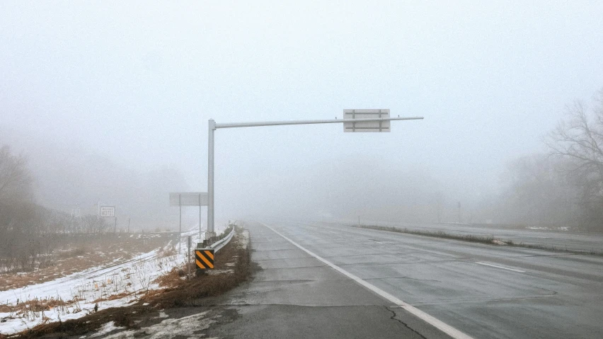 an icy, gray weather is causing traffic on the highway