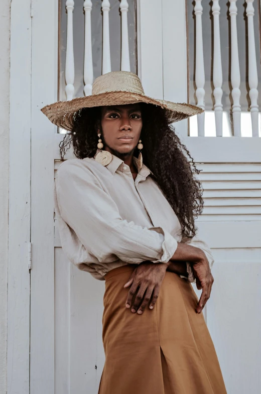 a woman is wearing a hat, and a shirt