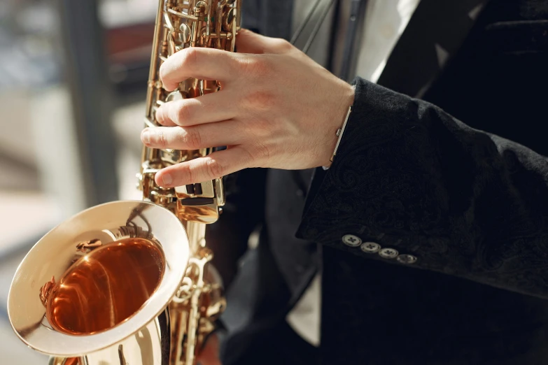 a person in a suit plays a saxophone