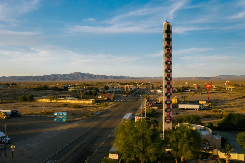 a big sign sits in the middle of a highway