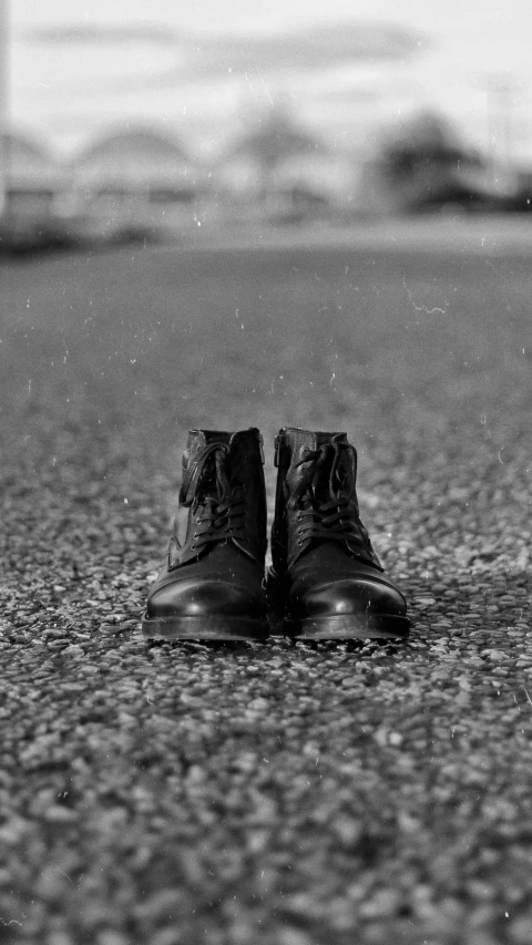 a close up of the top of shoes on the ground