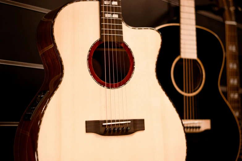 acoustic guitars are displayed on display in a building