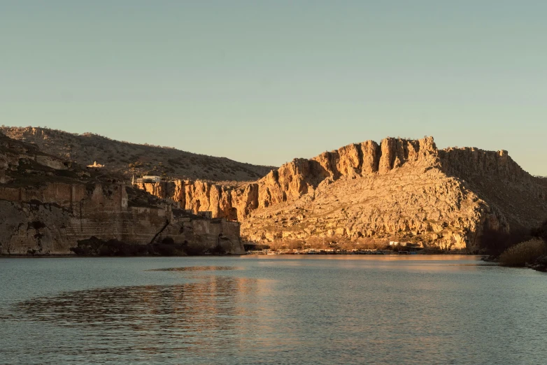 a body of water near a mountain range