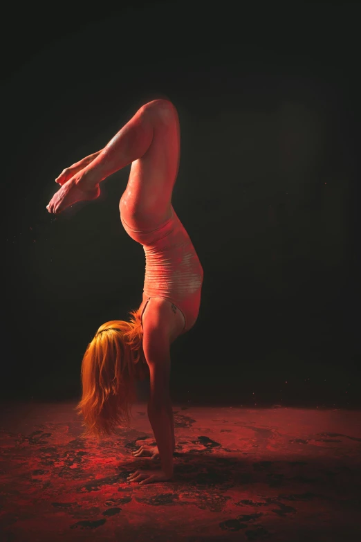 an artistic image of a  woman performing a handstand