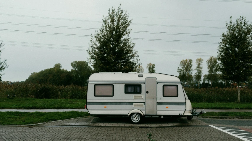 an empty motor home parked in a parking lot