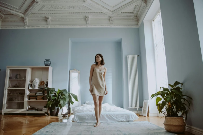 a woman in dress standing on an air mattress