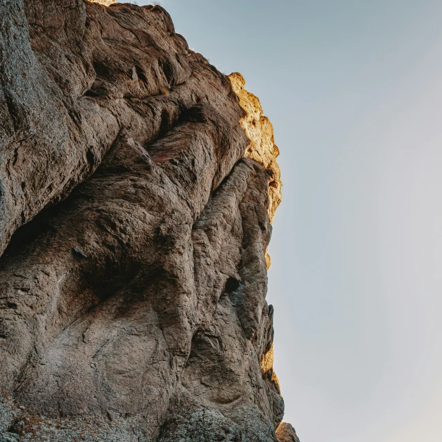 a rock face is seen from the side