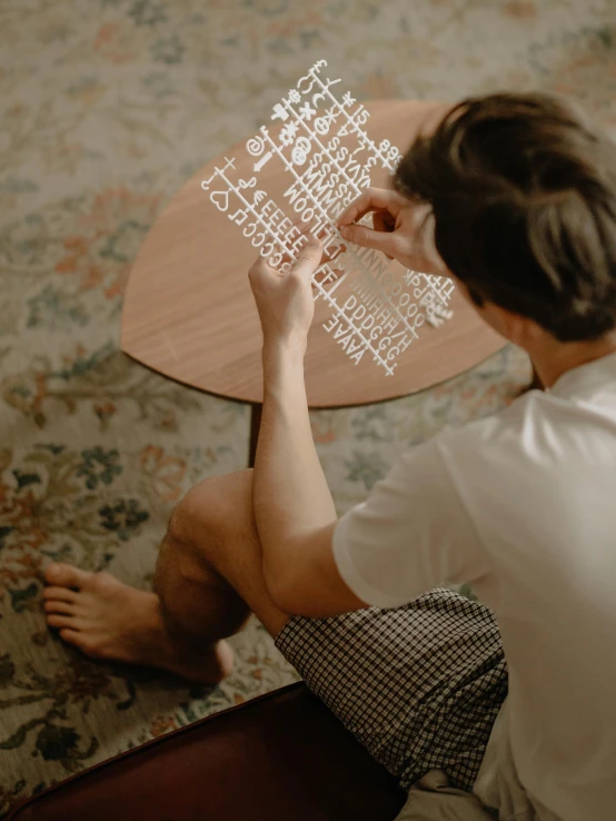 person reading a word on the table