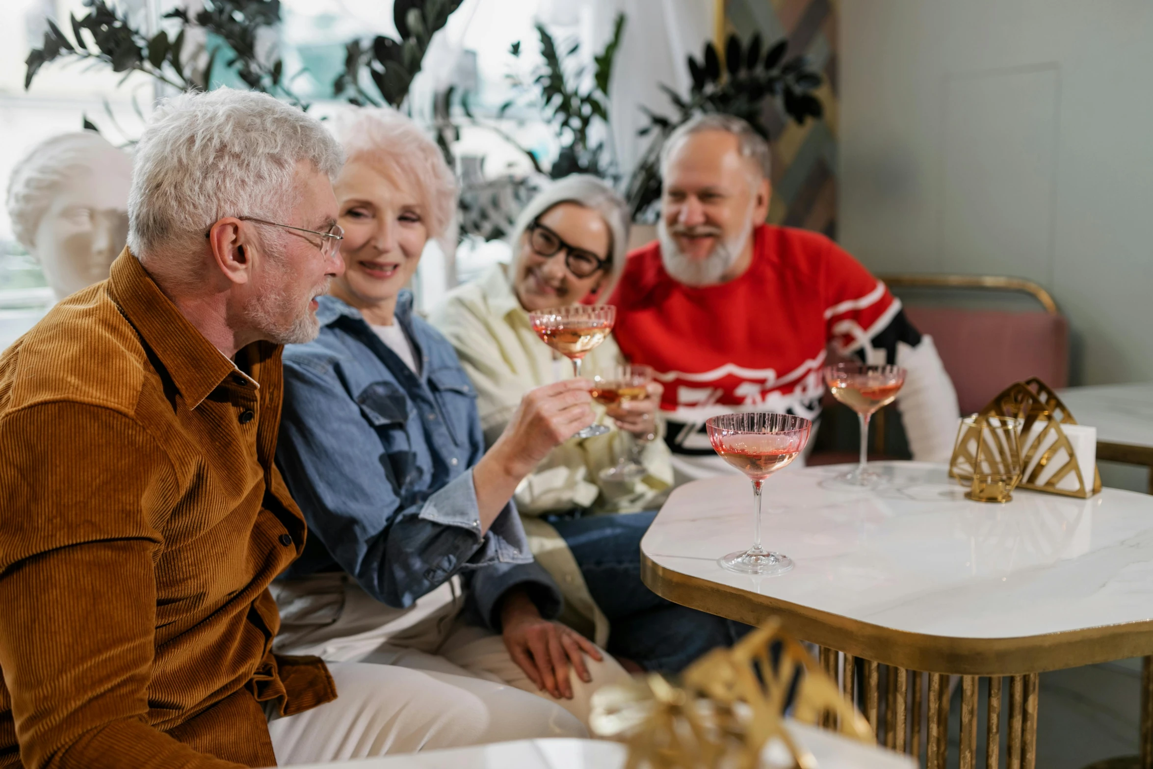 people sitting down and drinking wine at an event