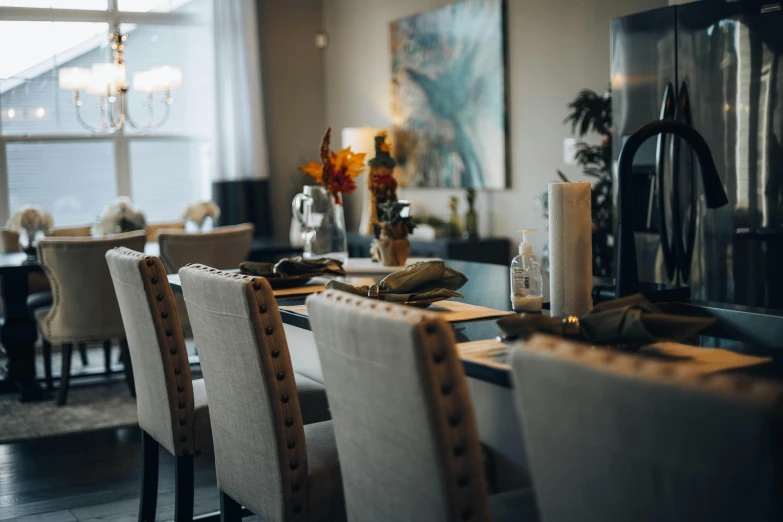 a modern dining table and chairs in a very big house