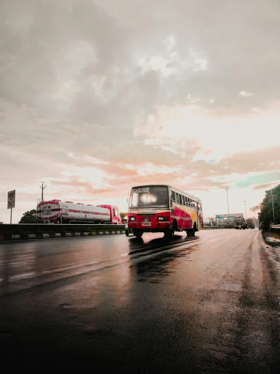 a large bus is driving down the road