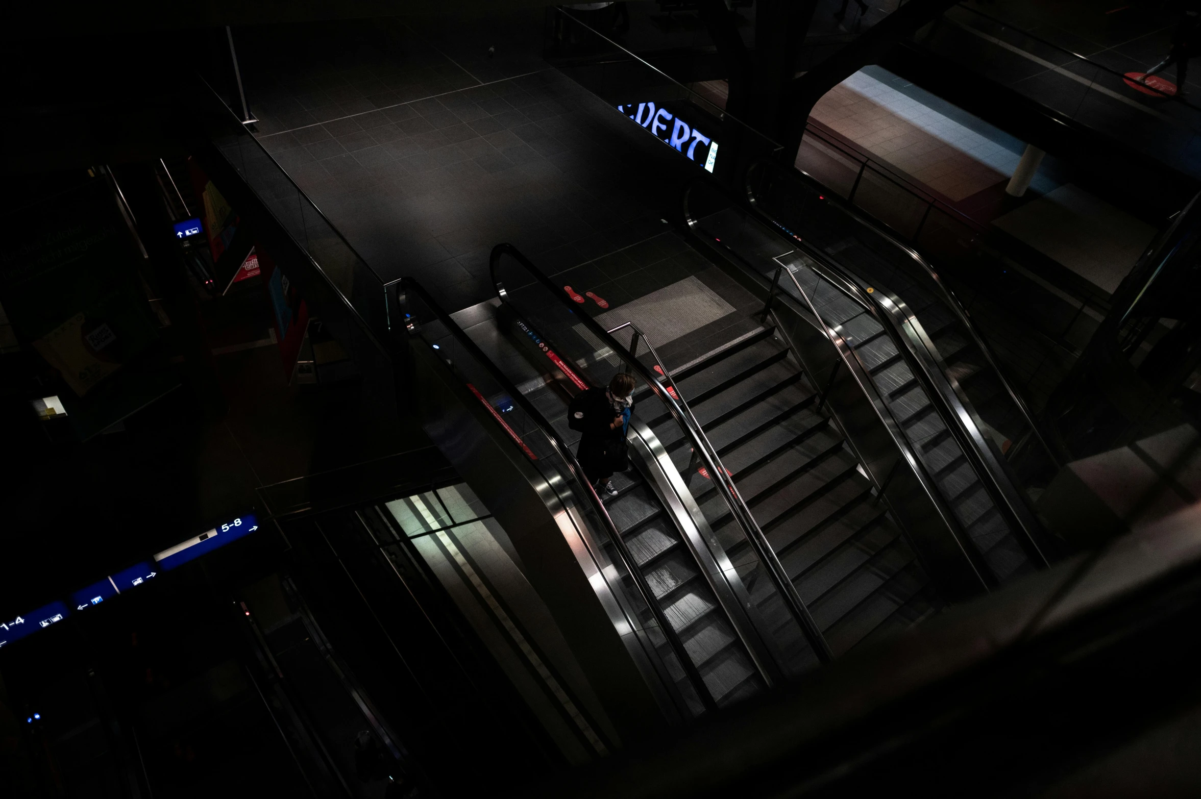 a stairwell with stairs lit up with blue light