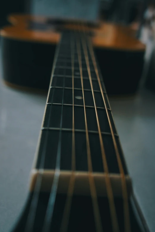 an acoustic guitar has a thin wooden strip