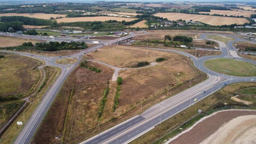 an aerial view of a highway intersection on a road