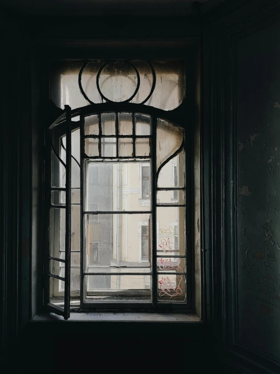 a window with metal bars and a window pane