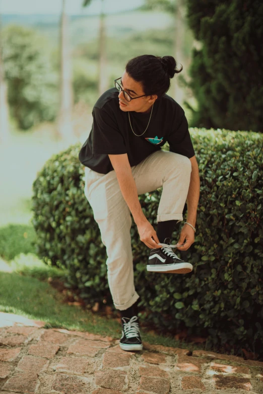 a  in black top doing skateboard tricks