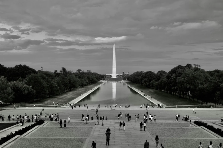 people walking around at the lincoln memorial in black and white