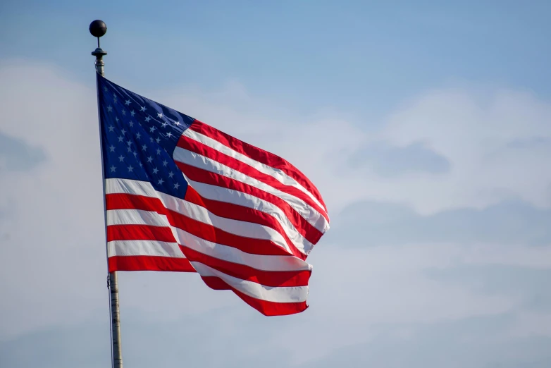 a po of an american flag flying on a pole