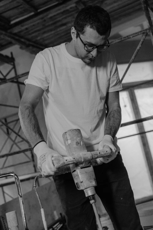 a man sanding the front part of a bike