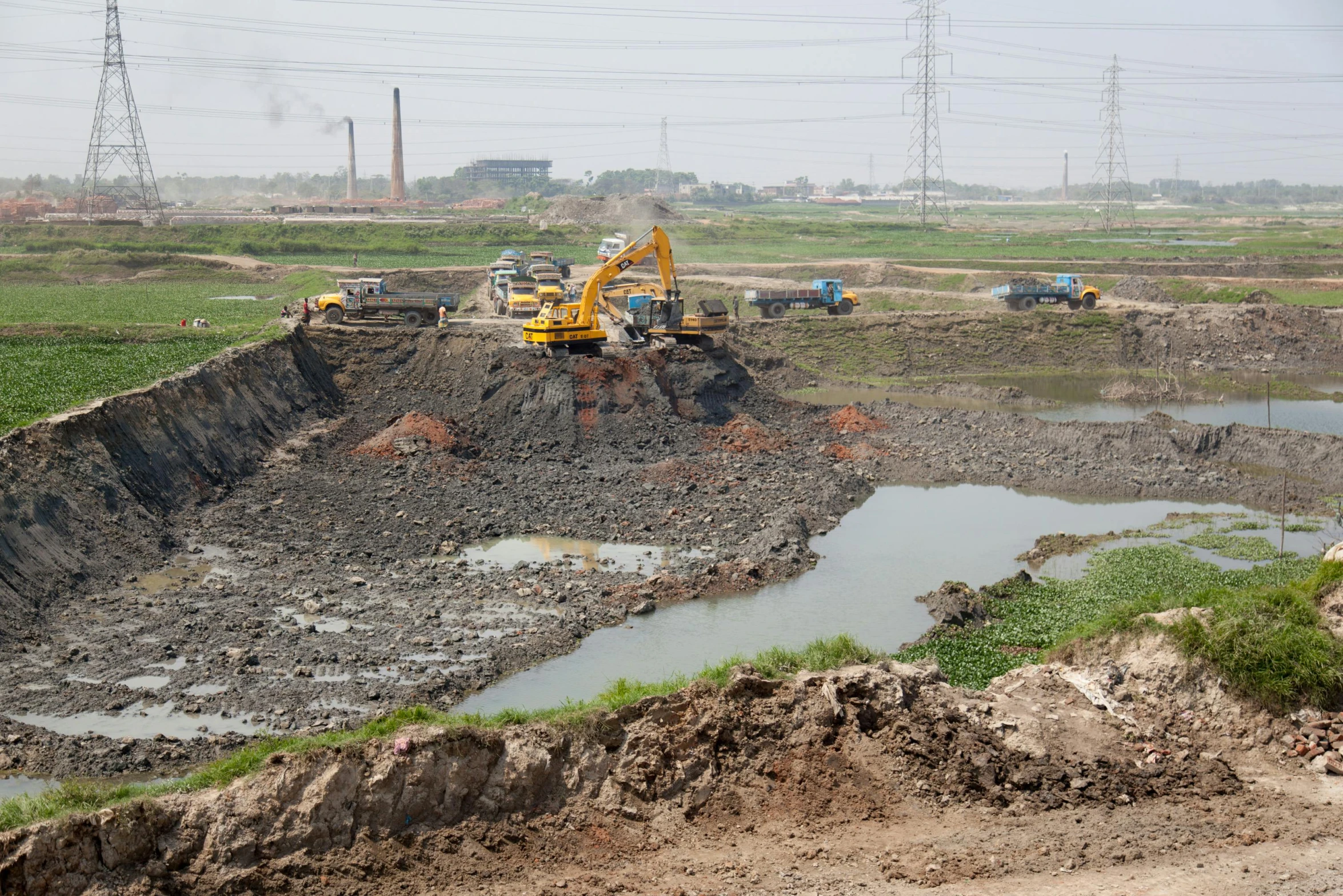 there is an excavation in the field where they are digging