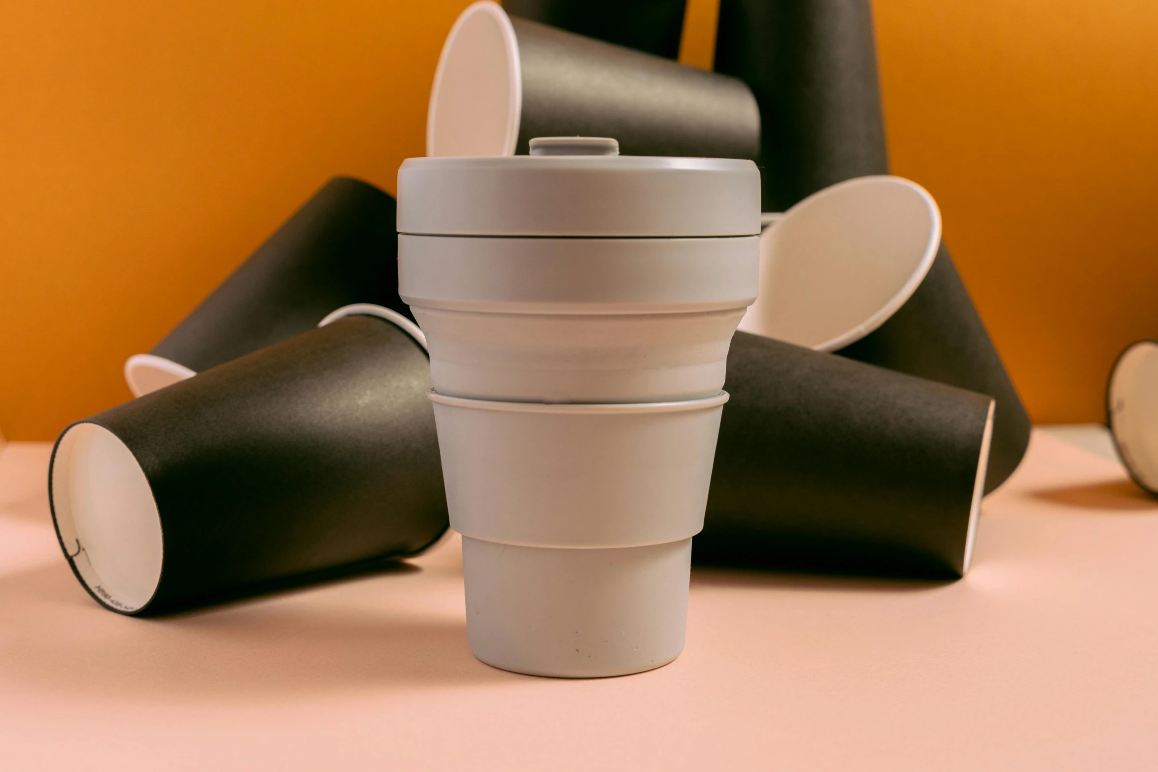 a pile of empty coffee cups on a table