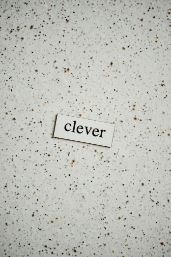 a piece of cardboard with the word clever on it