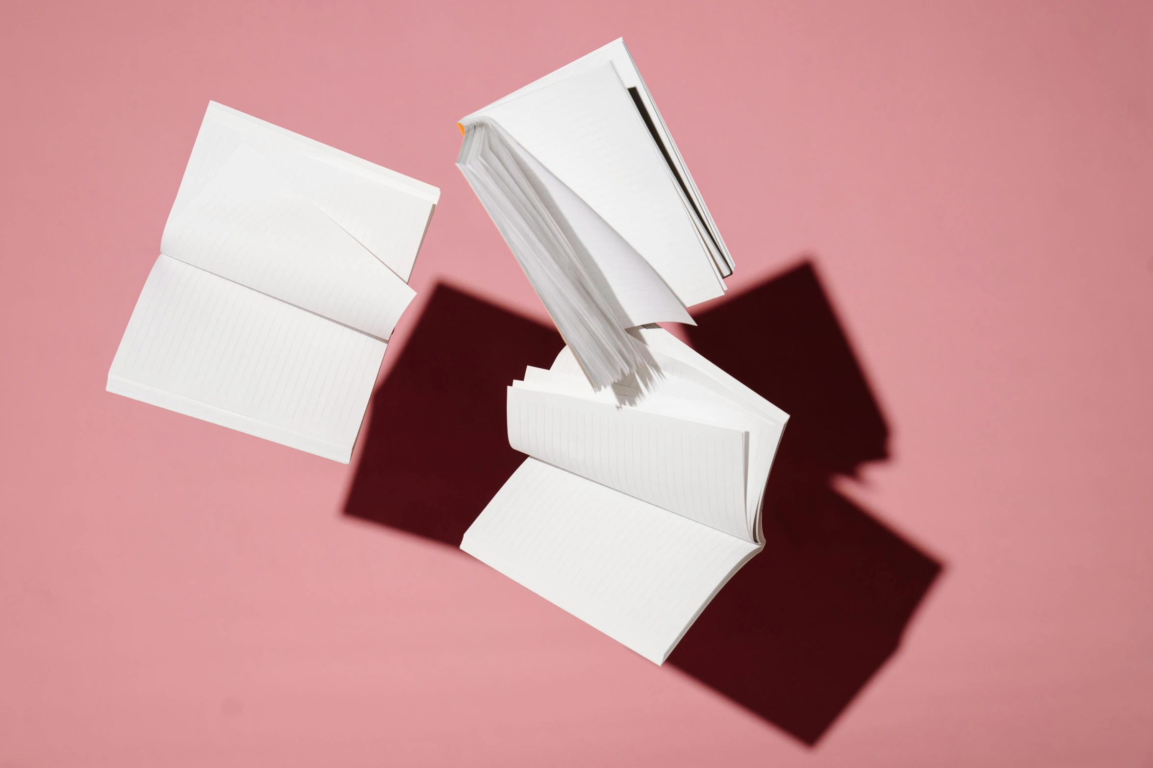 three open envelopes, one empty and one half with some white paper on it