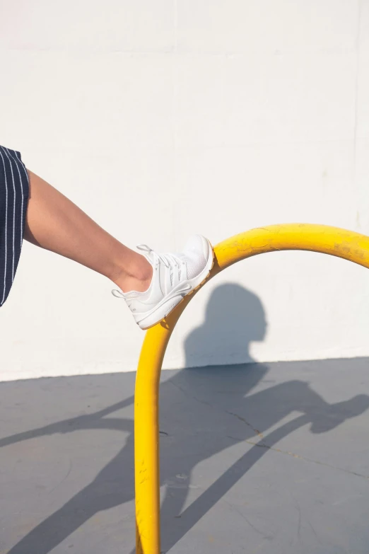 a skateboarder balancing on top of a hand rail