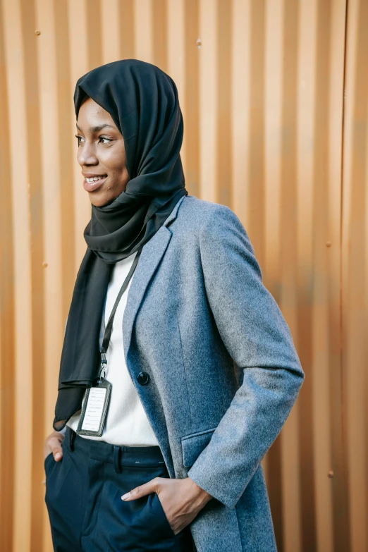 a young african american woman with a hoodie over her head