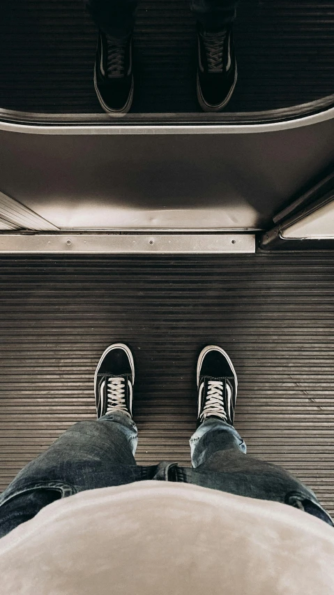 a person is sitting in the middle of a platform