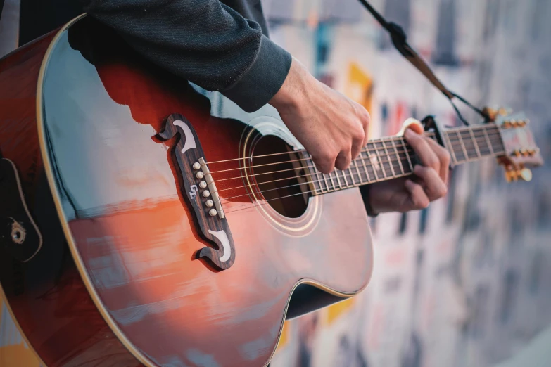 a man playing a guitar at a concert